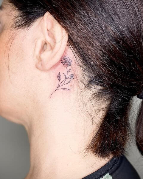 Rose Tattoo Behind Ear Meaning: The significance of designs featuring a tattoo of a rose behind the ear.