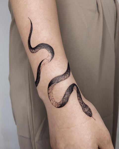 15 Black and White Snake Tattoo Designs  PetPress  Trendy tattoos Snake  tattoo design Hand tattoos